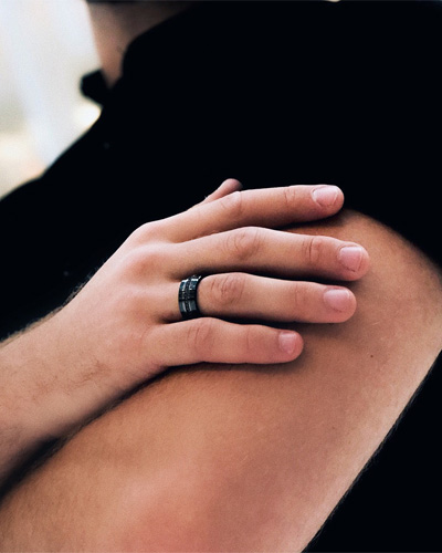 diamond ring on black hand